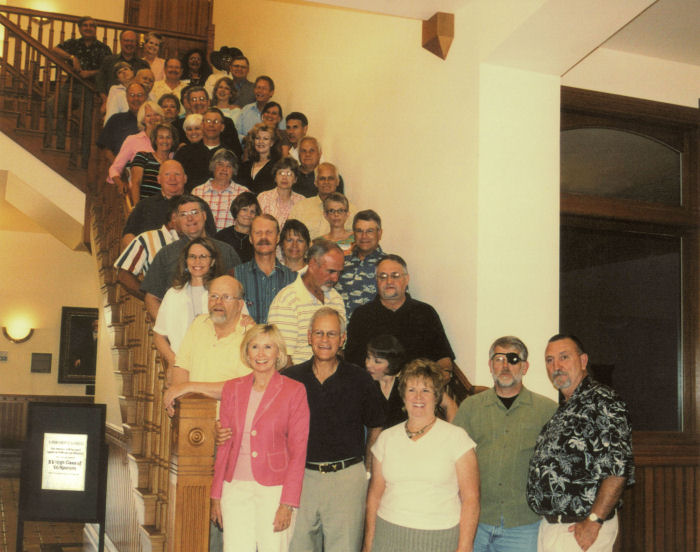 Classmates and spouses inside Academy Building